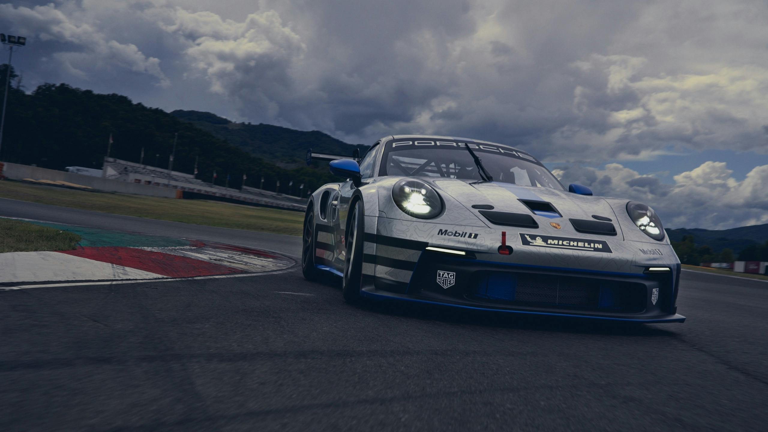 Porsche 911 GT3 front three-quarter dynamic action cornering