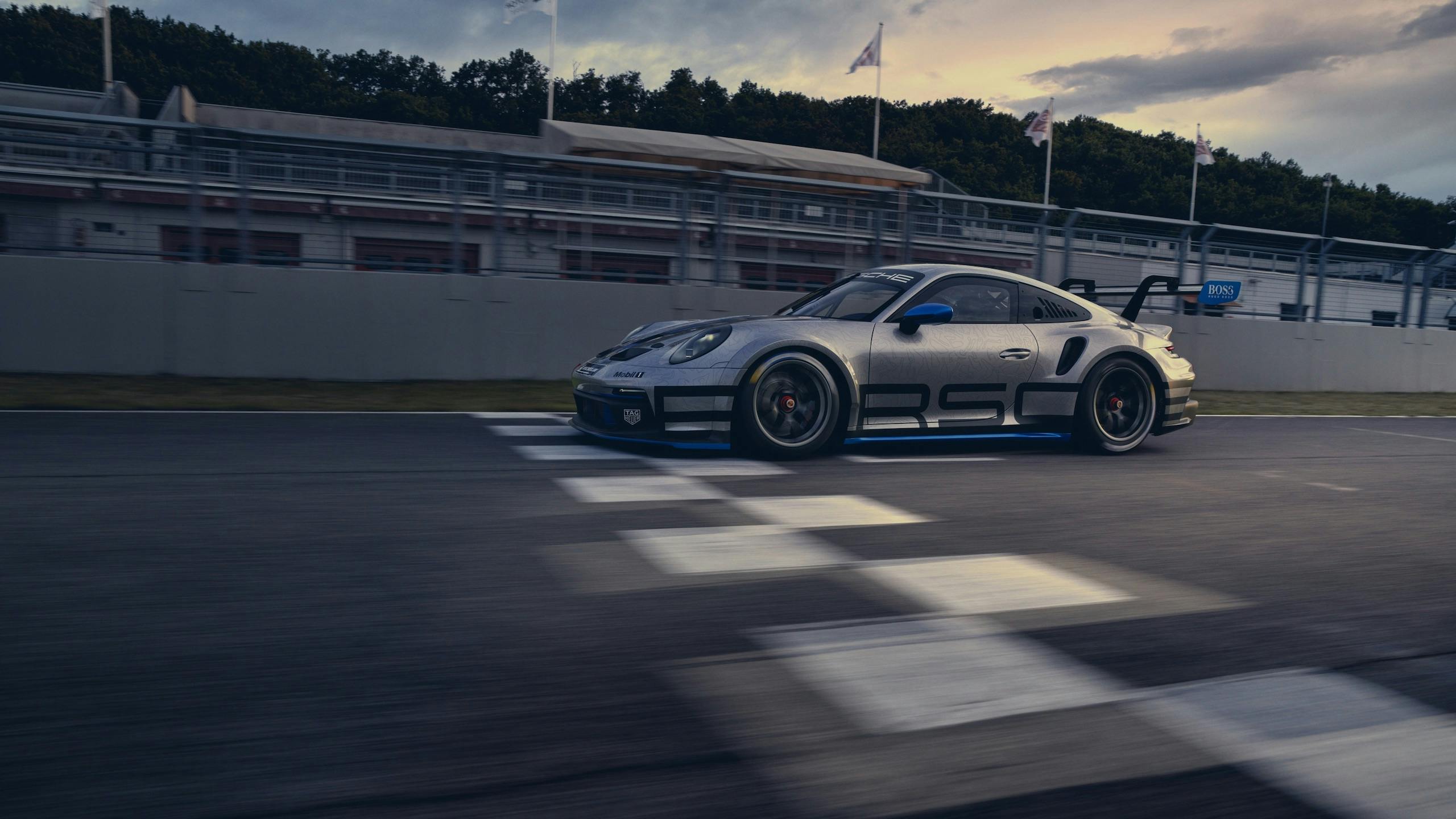 Porsche 911 GT3 crossing finish line dynamic action