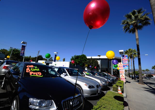 Used car dealership sales lot baloons