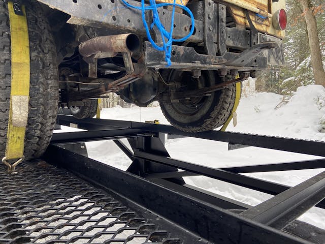 vintage jeep tire on trailer edge