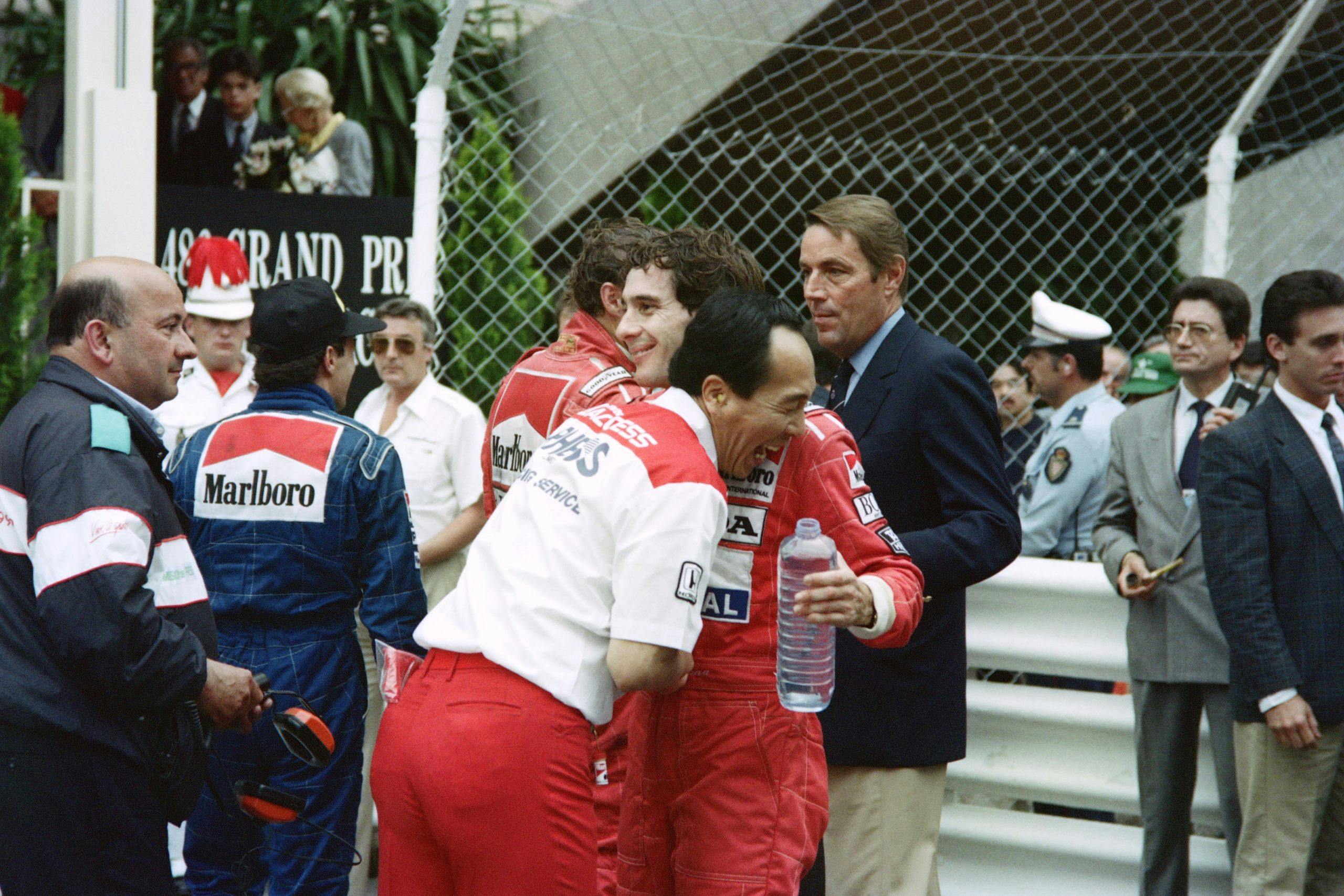 McLaren team member embraces Brazilian driver Ayrton Senna