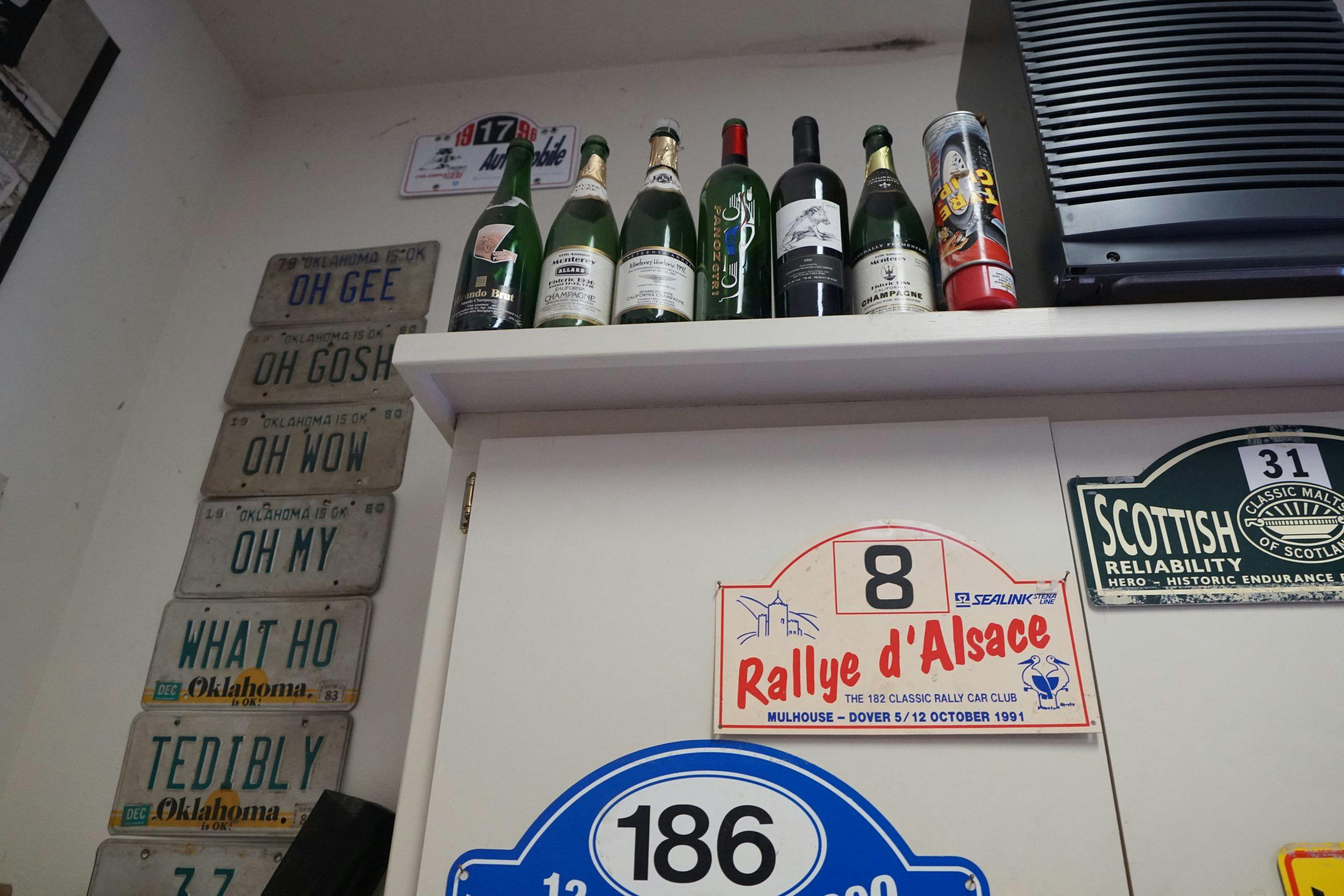 toly arutunoff garage license plates oh gee champagne bottles