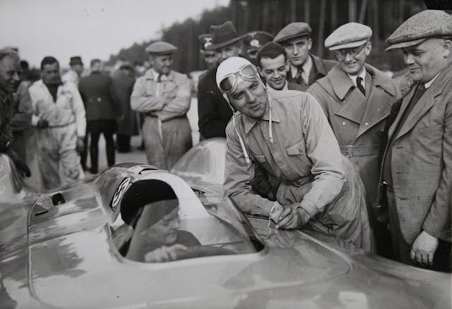 German Racing Driver Bernd Rosemeyer and boy laugh