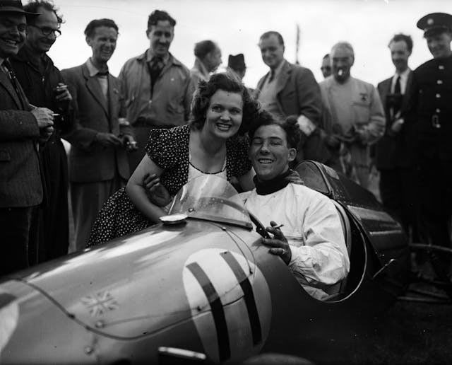 Stirling Moss being congratulated by Mrs John Cooper