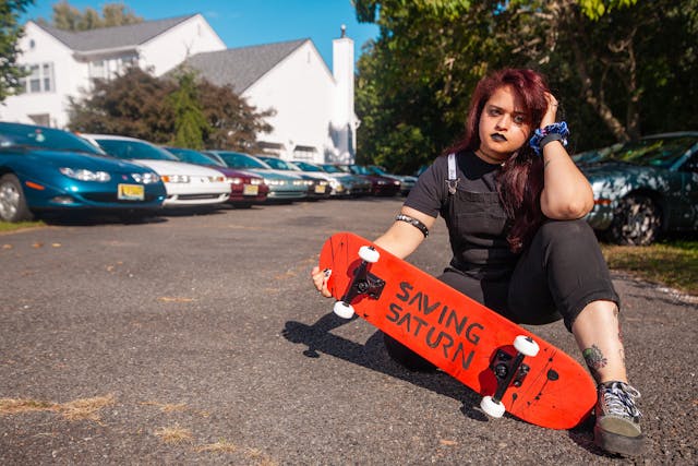 saturn enthusiast jessie skateboard sitting profile