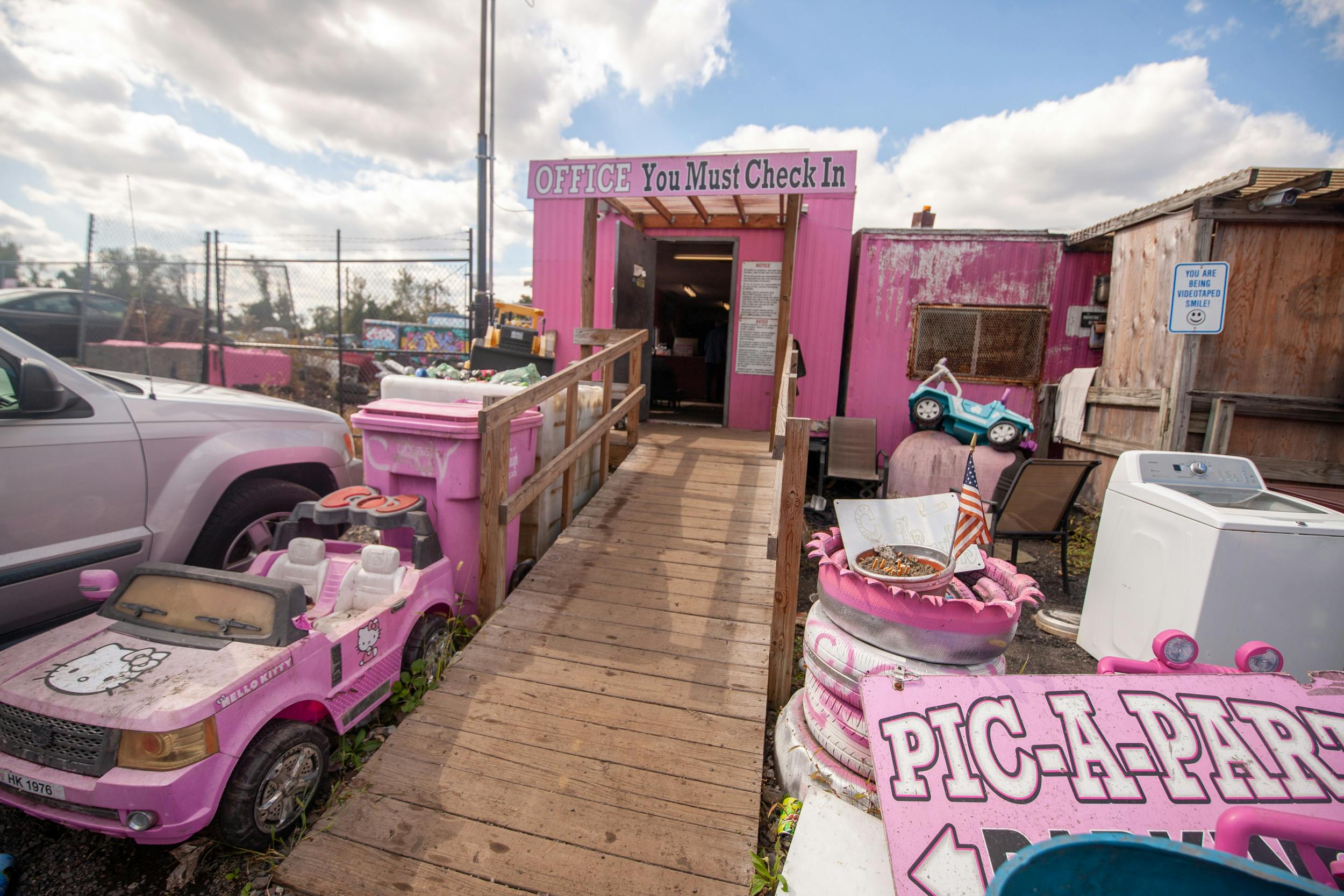pink pick a part junkyard office entrance