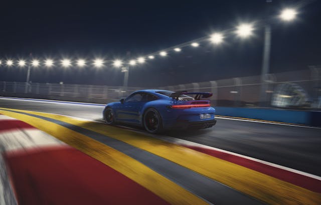 2022 Porsche 911 GT3 on track rear side profile