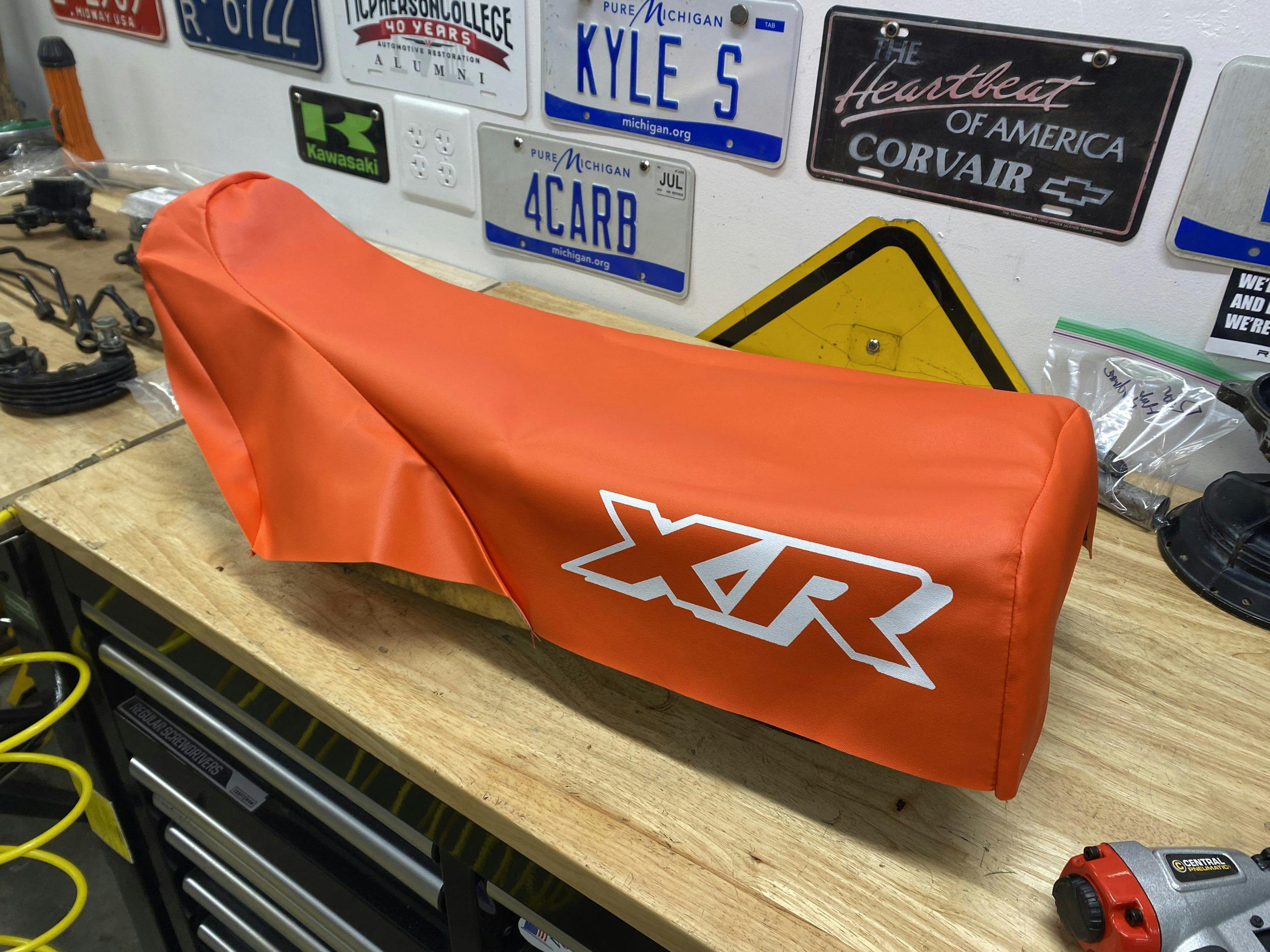 fitting cover on XR250 seat