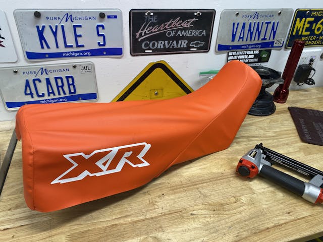 fitting cover on XR250 seat