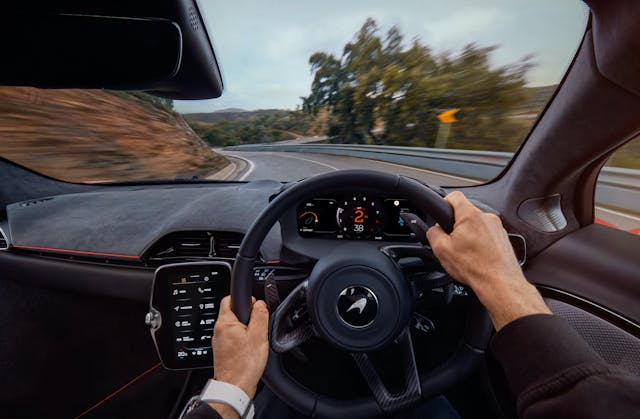 McLaren Artura orange interior road action