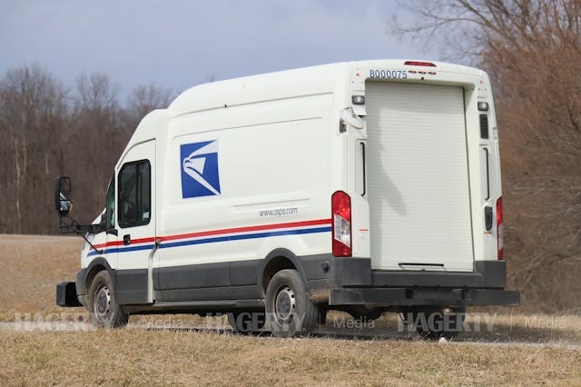 USPS Mail Truck Prototype Oshkosh Defense Ford Transit rear three-quarter