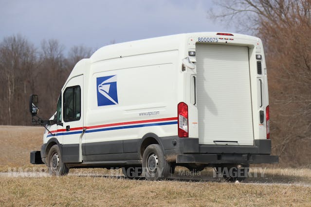 USPS Mail Truck Prototype Oshkosh Defense Ford Transit rear three-quarter
