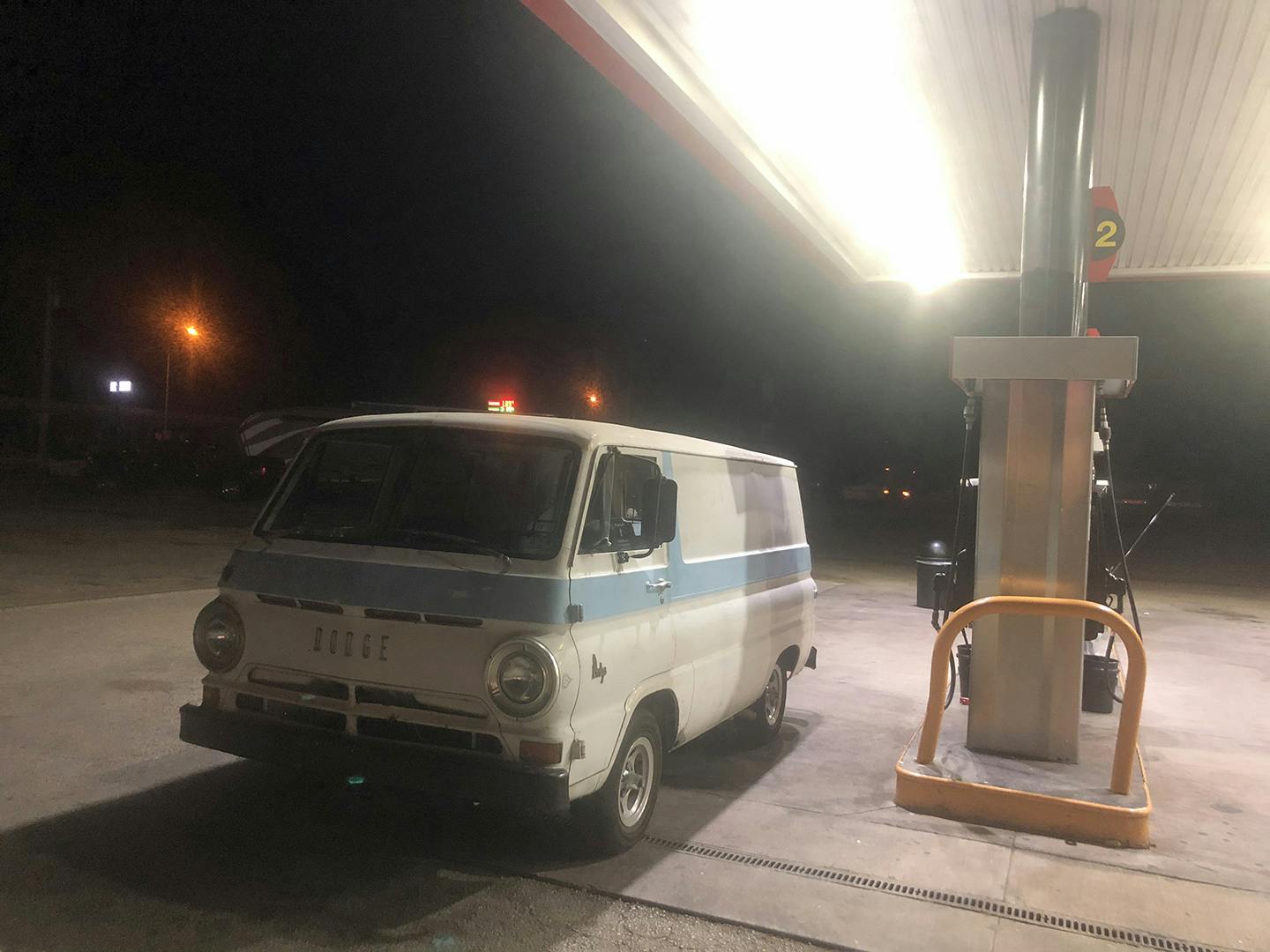 A100 Van rear three-quarter front three-quarter gas station