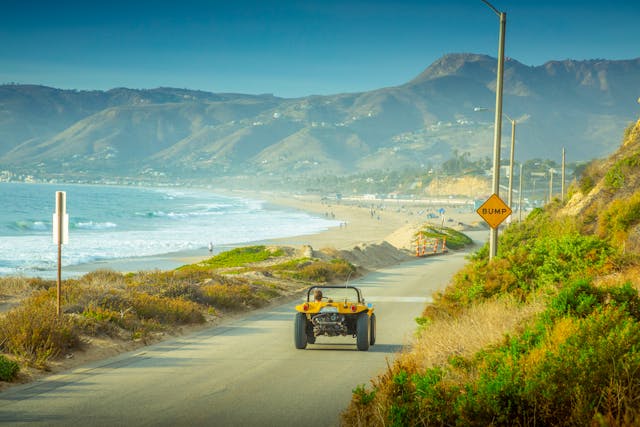 Meyers Manx Dune Buggy california coast rear driving action