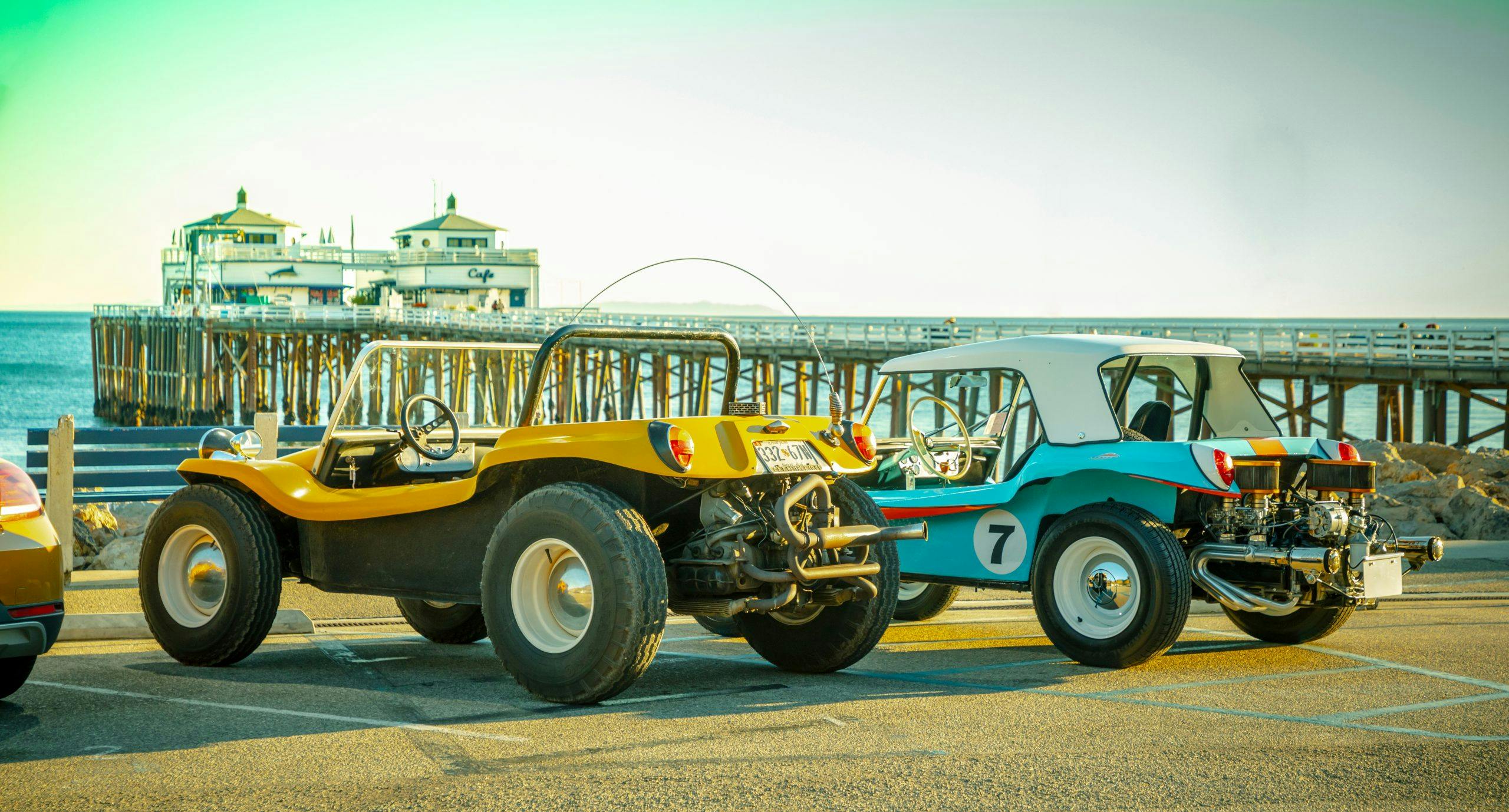 Meyers Manx Dune Buggies parked at beach rear three-quarter