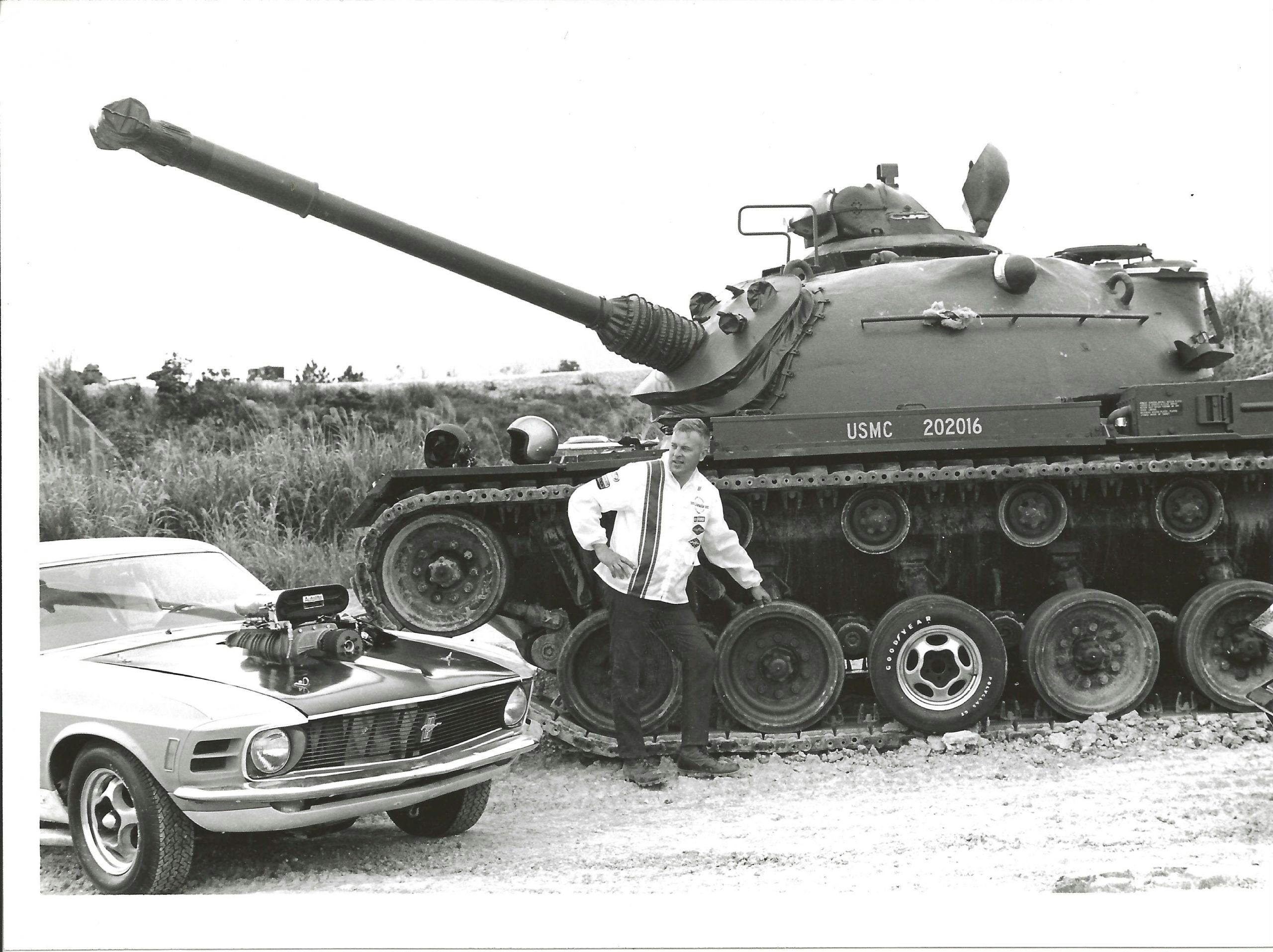 Lawman Boss 429 Ford Mustang historical car beside USMC battle tank black and white
