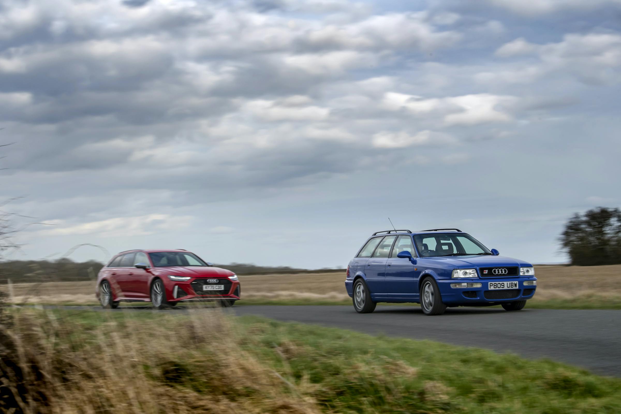 Audi RS2 leading RS6 countryside drive action