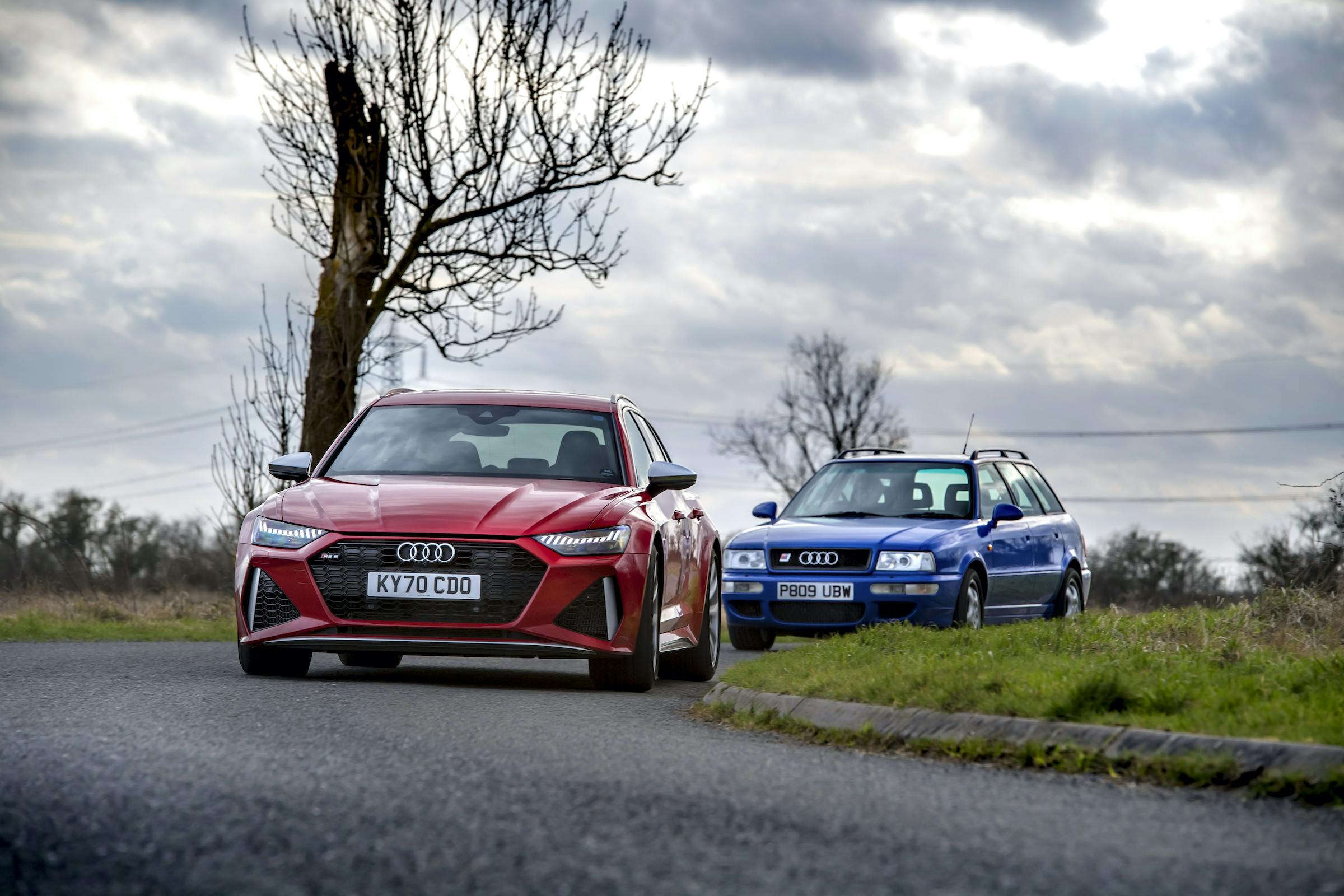 Audi RS6 leading RS2 cornering driving action