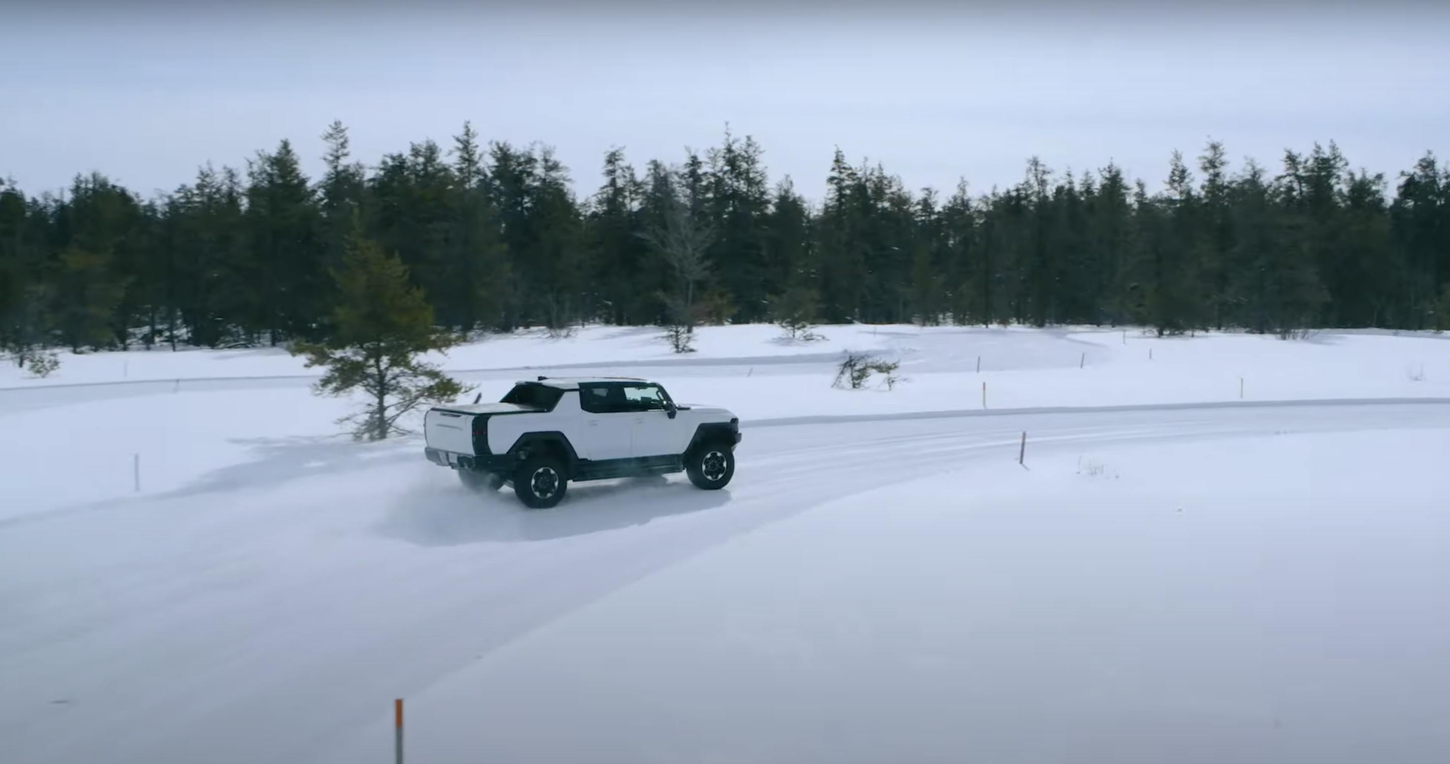 Hummer EV pickup winter testing rear camo snow