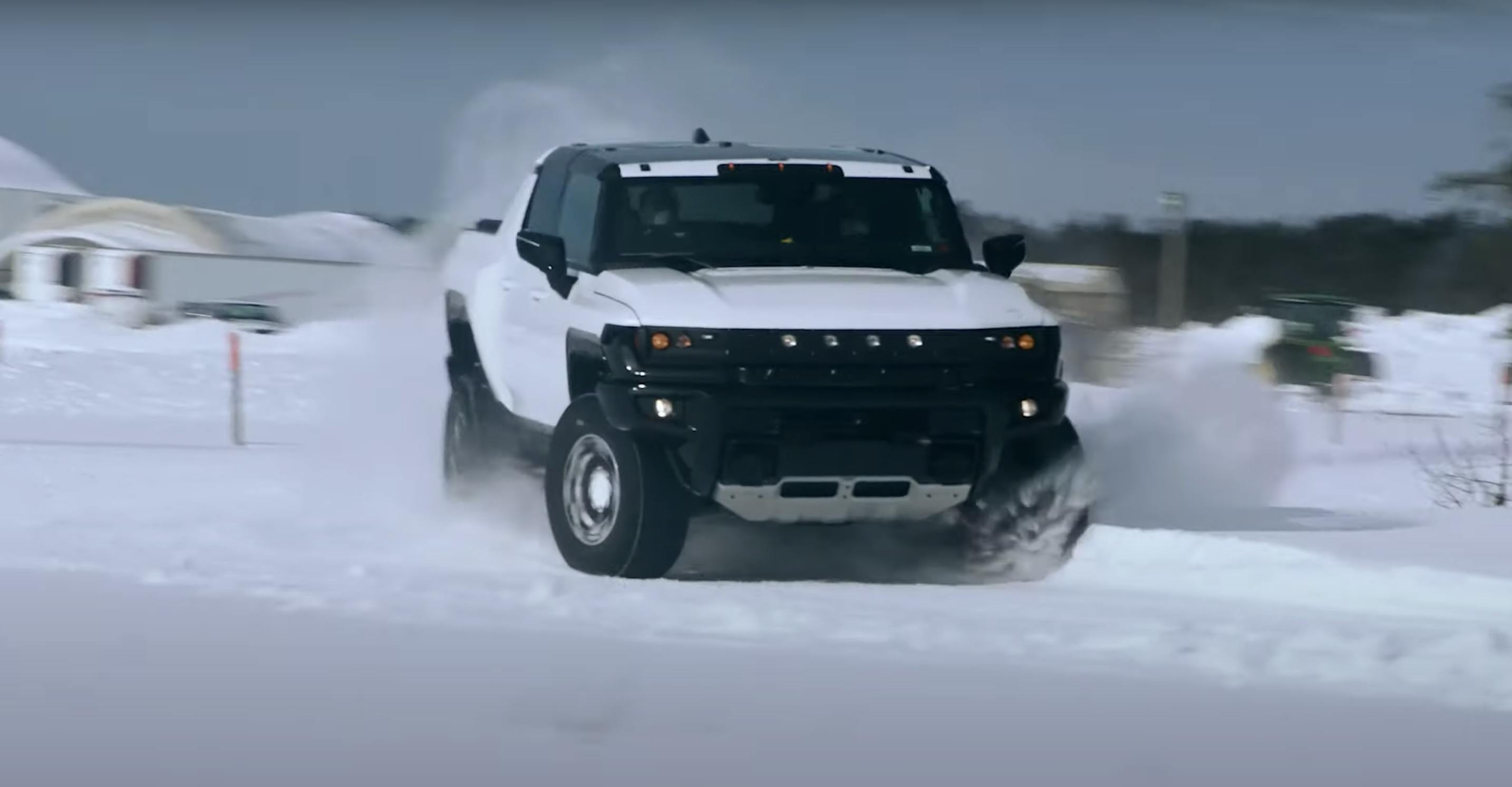 Hummer EV pickup winter testing front camo snow drift