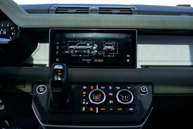 land rover defender interior infotainment screen on dash drive modes