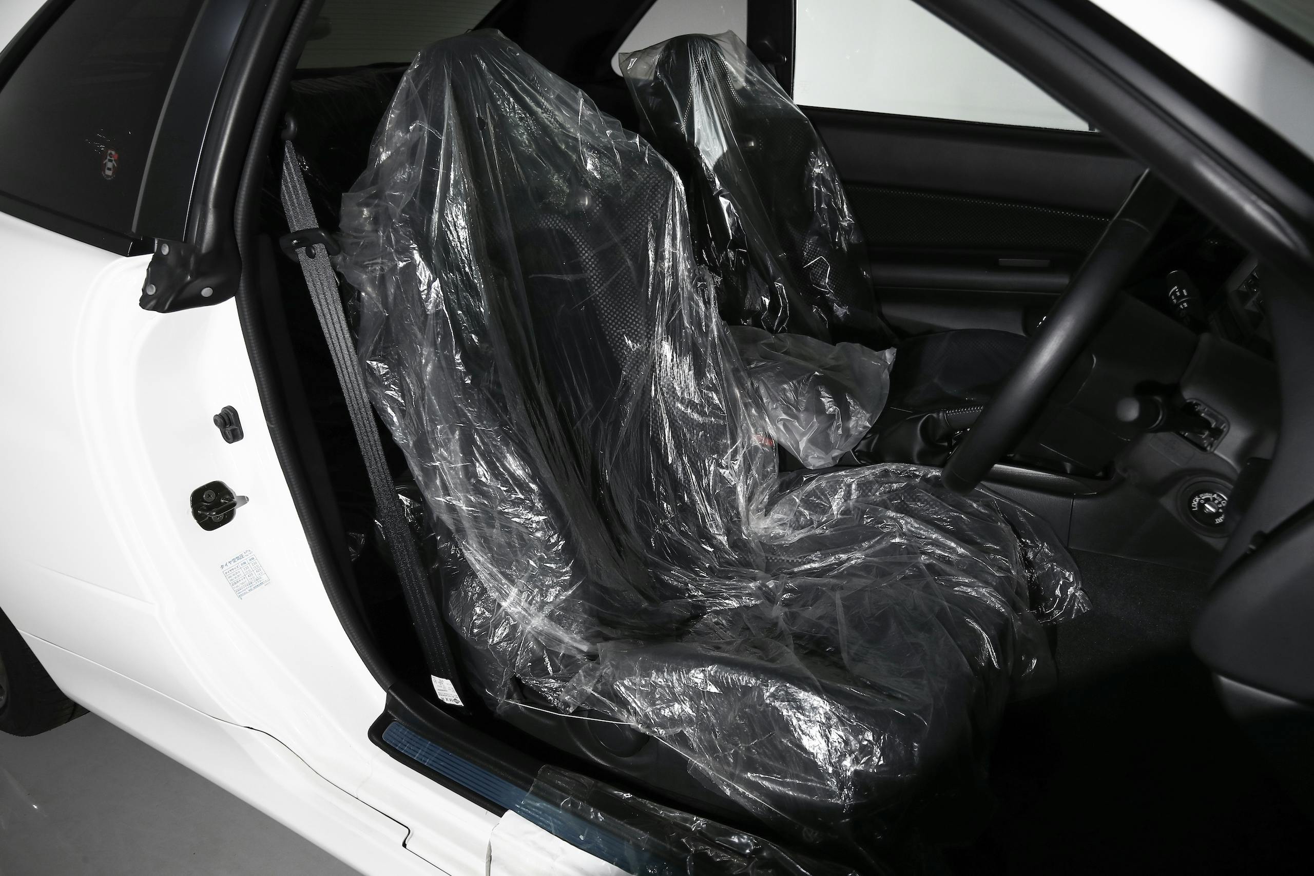 2002 Nissan Skyline GT-R interior plastic covered front seats