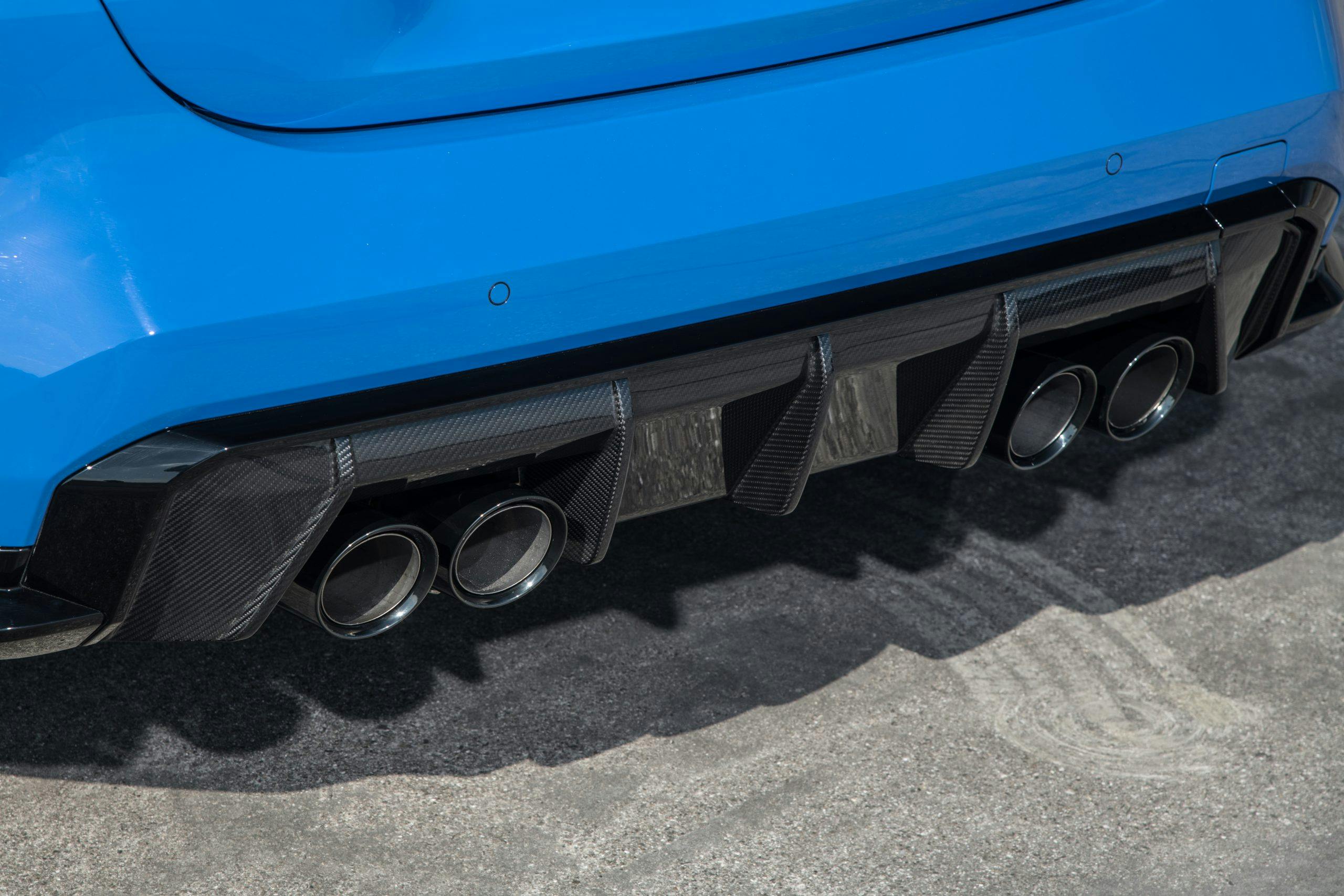 2022 BMW M4 Competition xDrive AWD carbon fiber rear diffuser exhaust detail