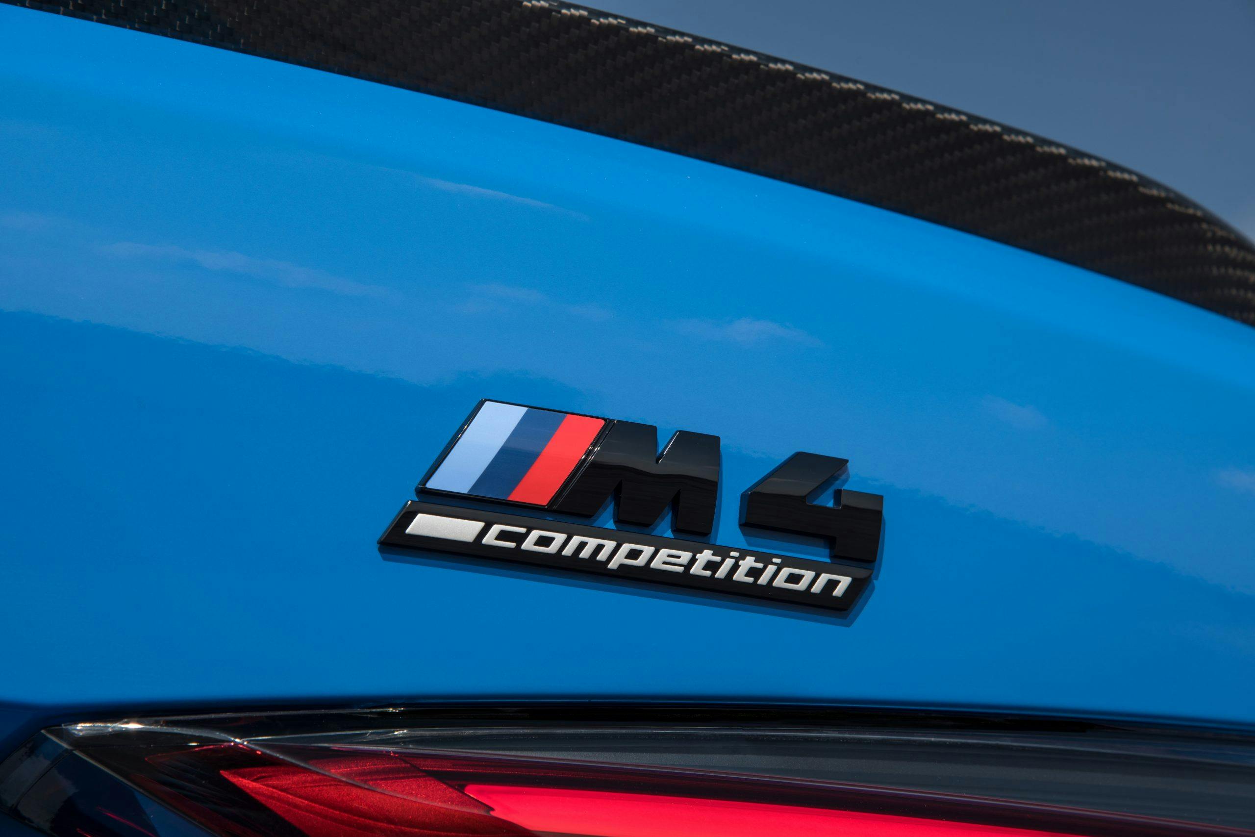 2022 BMW M4 Competition xDrive AWD carbon fiber logo rear detail