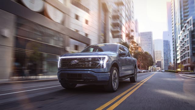 Ford F-150 Lightning EV front three-quarter urban action