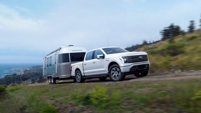 Ford F-150 Lightning EV front three-quarter airstream towing action
