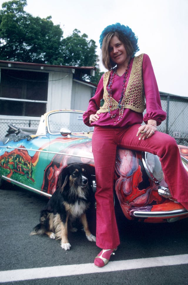 Janis Joplin with her ’65 Porsche, and dog.
