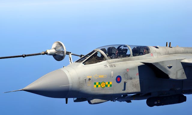 British Typhoon fighter jet approaches a Canadian Boeing CC-150 Polaris in-flight refueller tanker aircraft