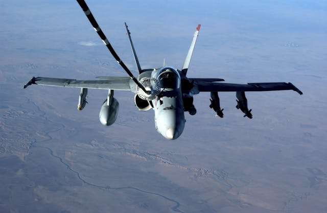 F/A-18C Hornet receives fuel from a U.S. Air Force KC-10 Extender
