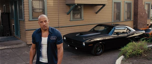 Fast and the Furious scene of Vin Diesel standing in front of a Charger