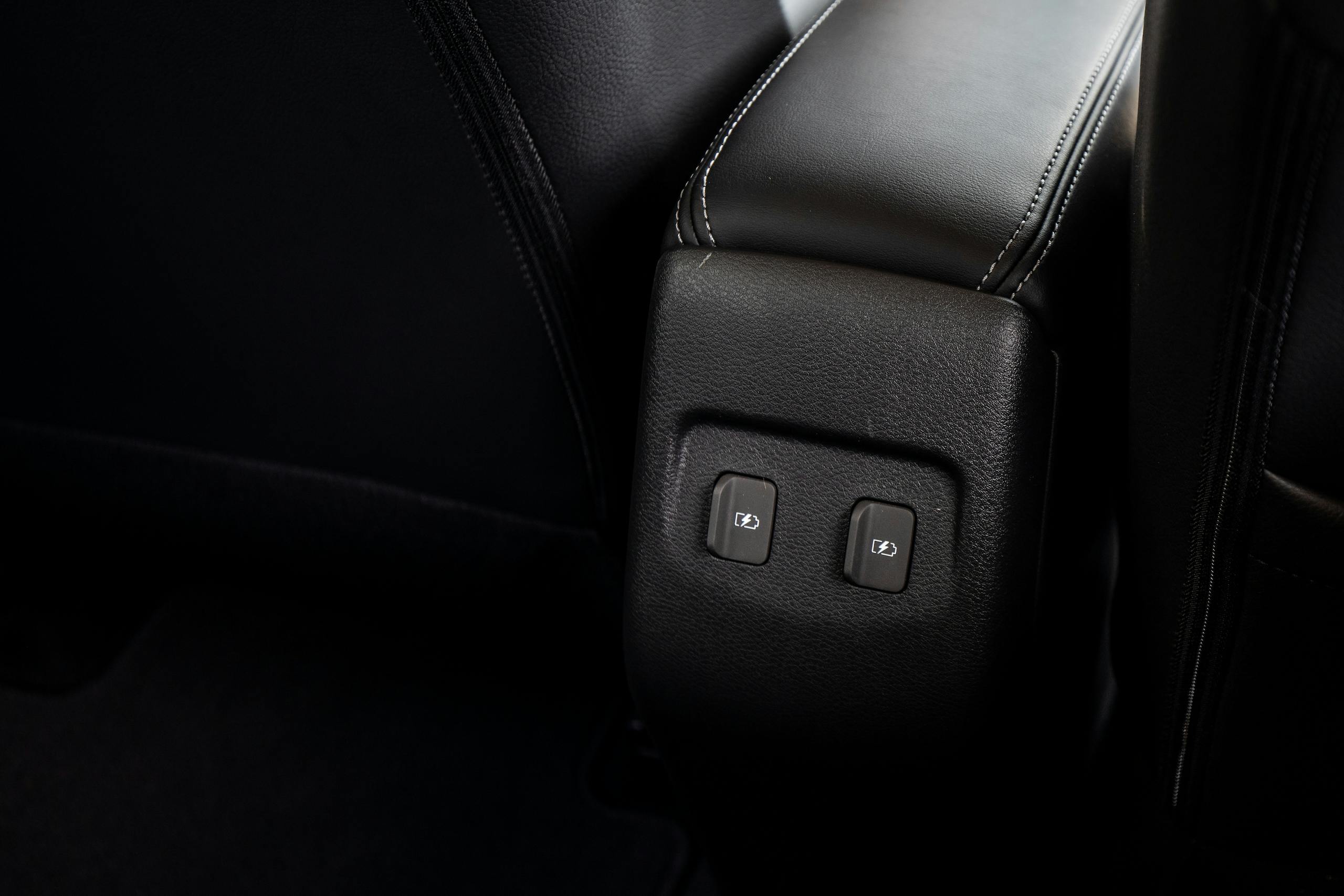 Nissan Kicks interior rear console trim power ports