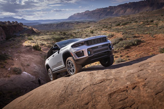 2022 Jeep Grand Cherokee Trailhawk 4xe right front three quarter up rocks