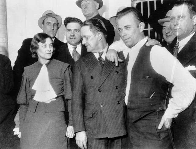 John Dillinger with Police Officials