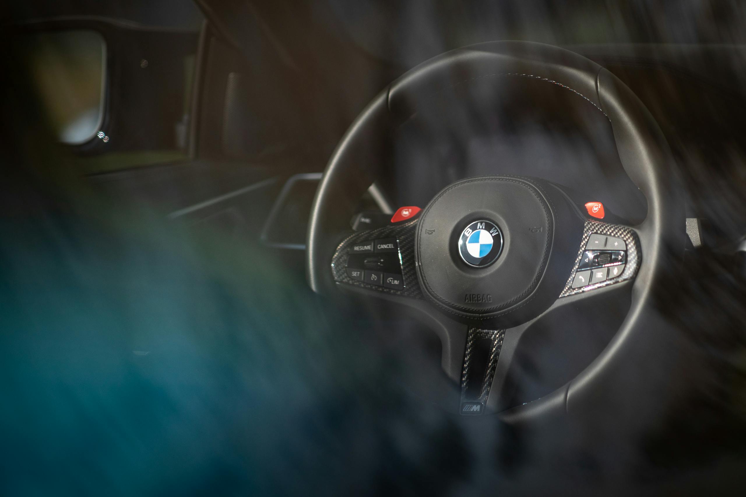 2021 BMW M4 interior steering wheel through glass
