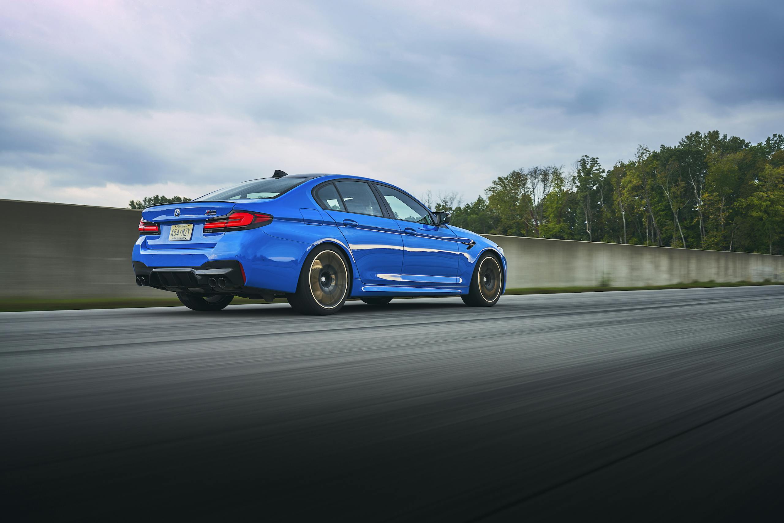 2021 BMW M5 Competition rear three-quarter track action straight