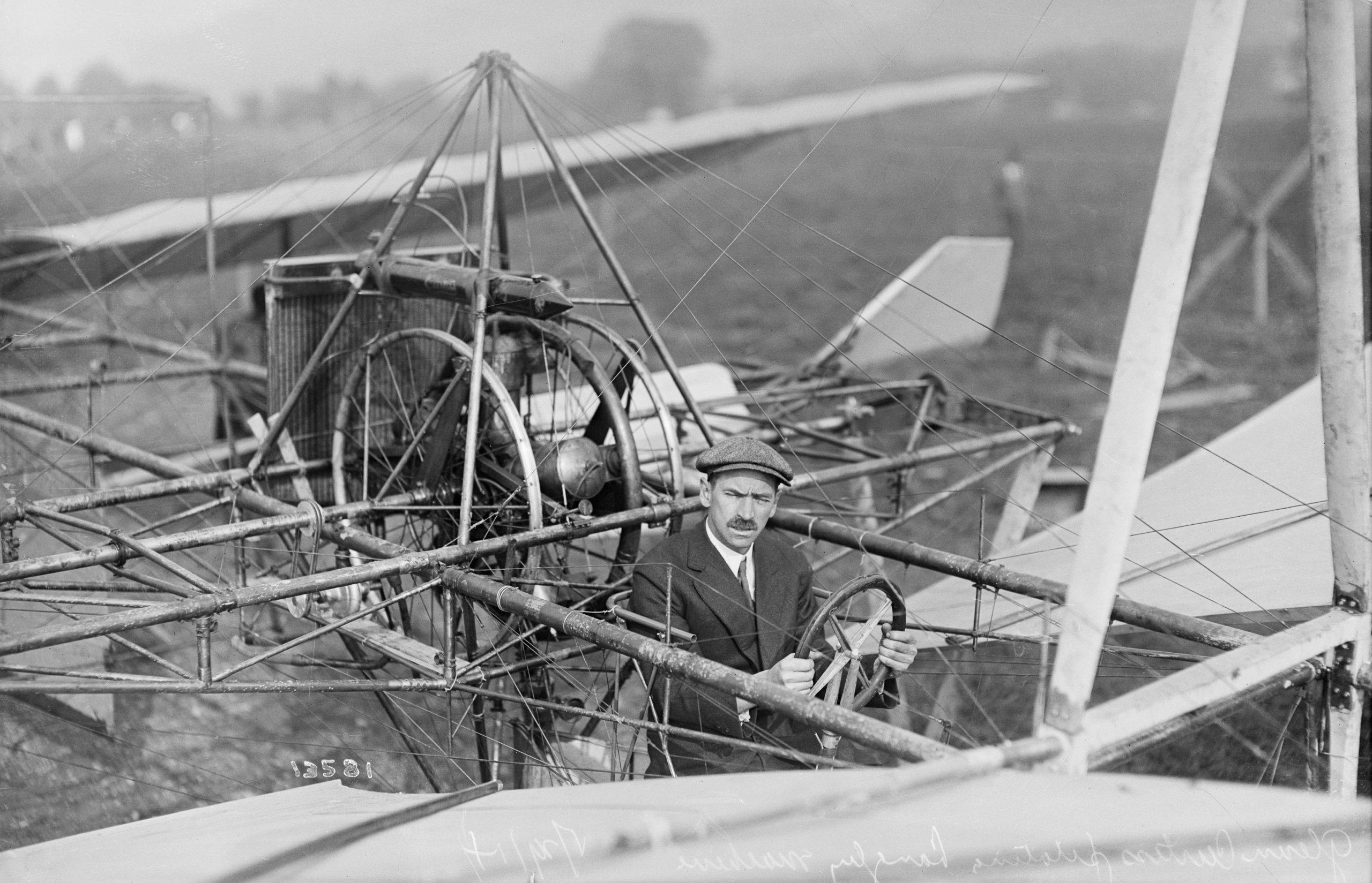 Aviator Glenn Curtiss Sitting in Early Aircraft