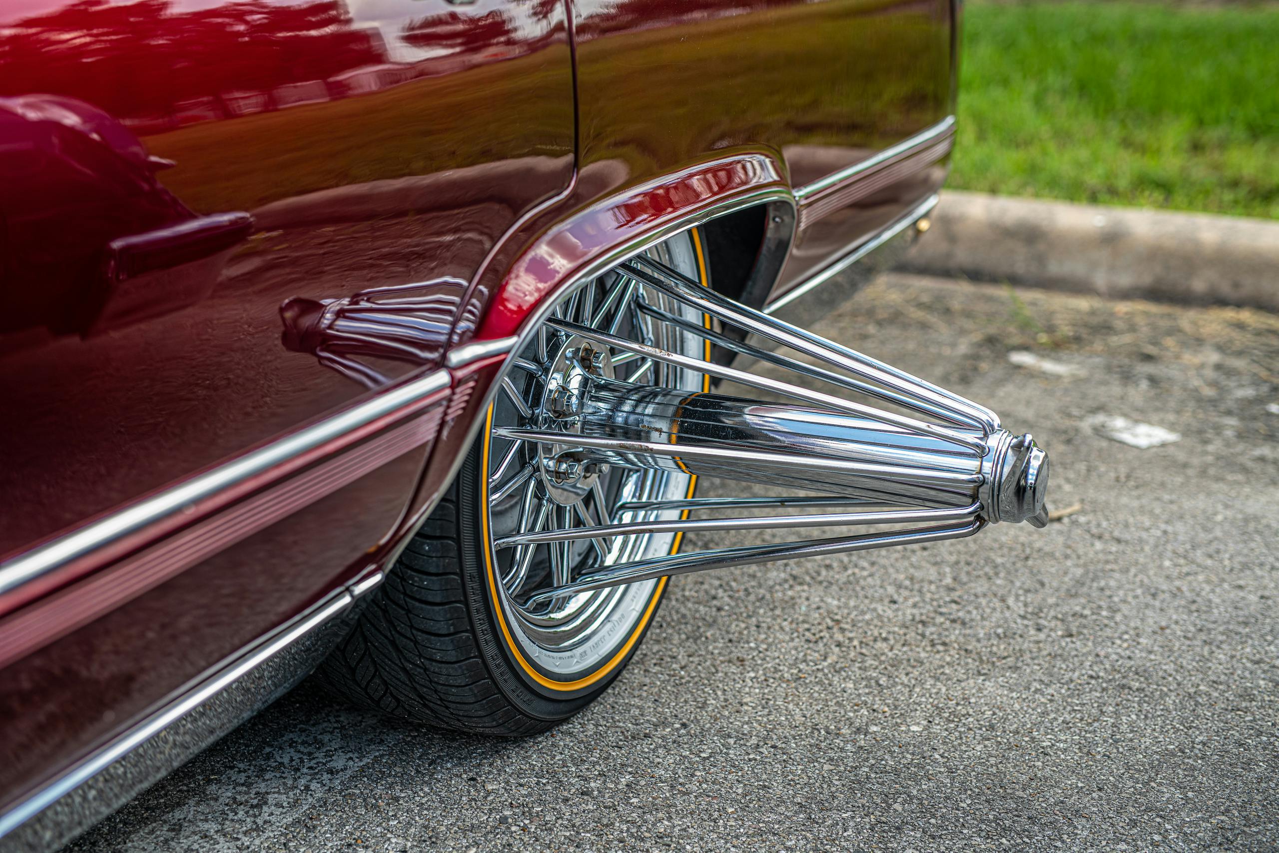 Houston slab car red Cadillac wheel closeup
