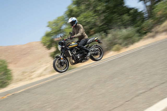 Kawasaki Z900RS side profile dynamic riding action