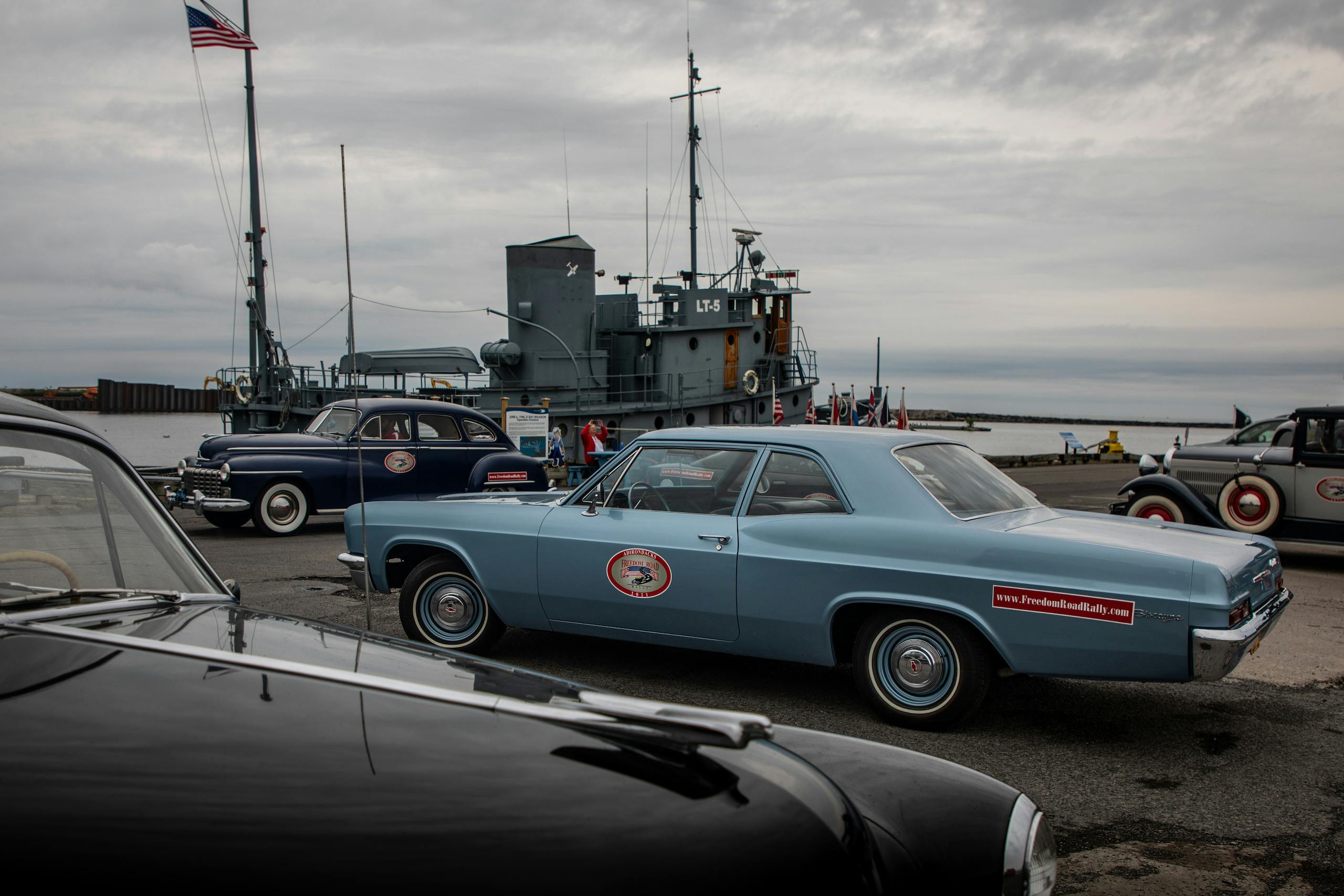 Freedom Road Rally group cars and military ship