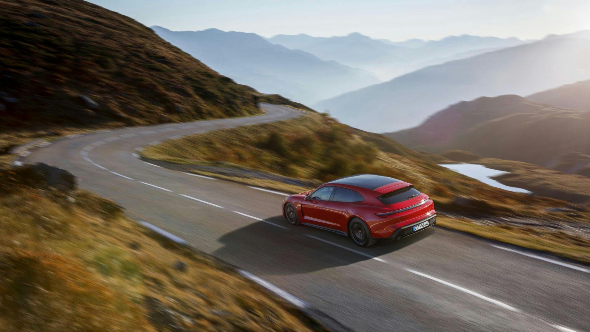2022 Porsche Taycan GTS Sport Turismo wagon driving above rear