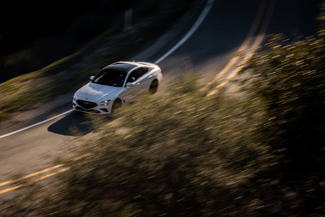 2022 Genesis G70 front three-quarter dynamic action high angle