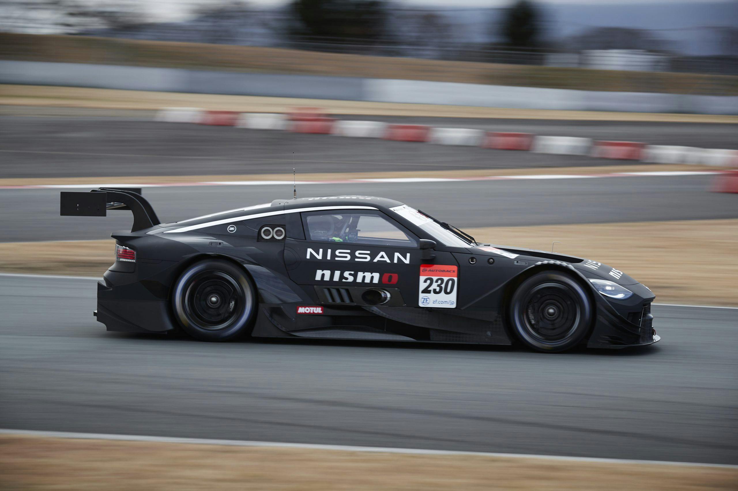 Nissan NISMO Z GT500 on track at speed side profile