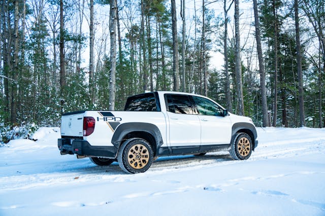 2021 Honda Ridgeline AWD Sport passenger side rear three quarter low snowy path