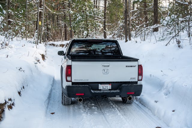 2021 Honda Ridgeline AWD Sport high rear angle on snowy path