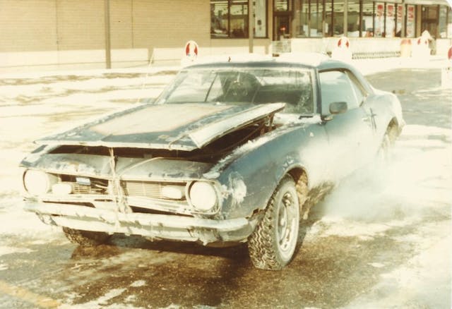 snow and ice covered classic muscle car