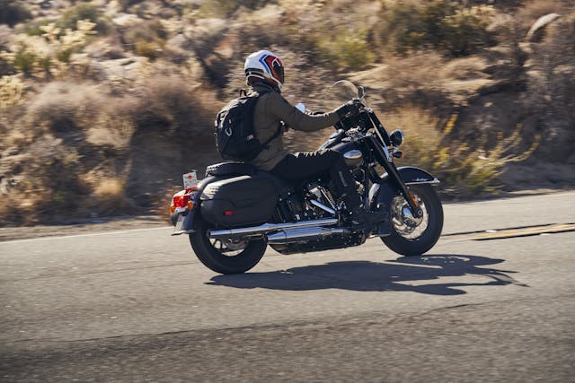 Harley heritage classic rear three-quarter riding action